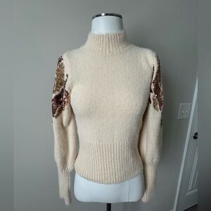Fun Cream Sweater with Sequin Details on sleeves. Dress up or dress down…